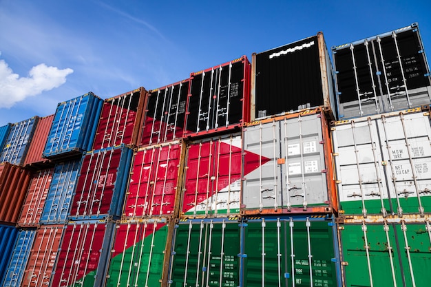 national flag of Jordan on a large number of metal containers for storing goods stacked in rows