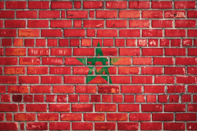 National flag of the Morocco on a grunge brick background