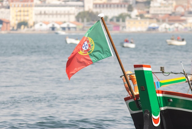 National flag of portugal waving in the wind on ships mast