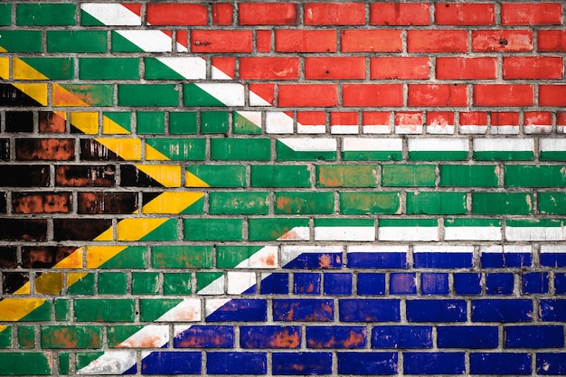 National flag of the South African Republic on a grunge brick background