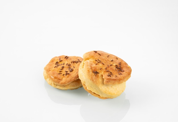 National Hungarian cuisineTwo buns with caraway seeds on a white mirror background