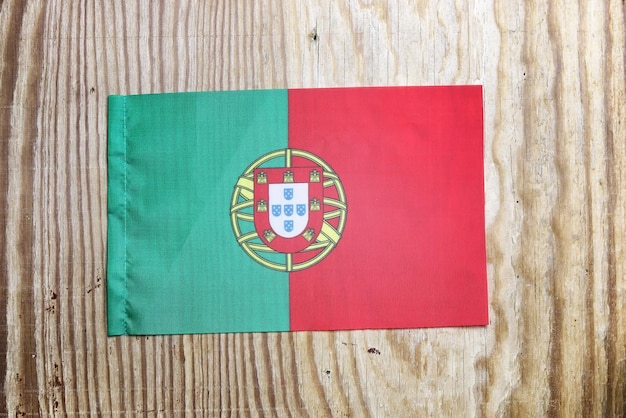 National textile flag on wooden table