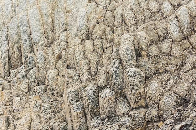 Natural background rock texture from weathered columnar basalt