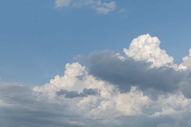 Natural background and texture. Gorgeous white clouds on blue sky on a sunny day