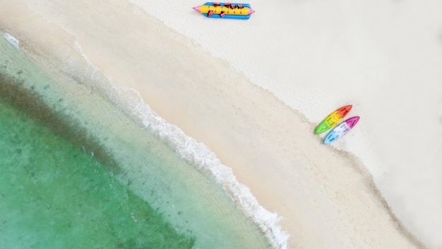 Natural Beach concept summer vacation Nature of tropical summer beach Umbrella board a boat and boat on the Sand Beach and Tourism Happy for playing on sand