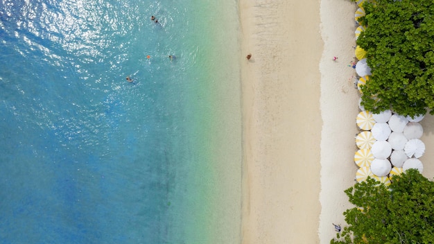 Natural Beach concept summer vacation Nature of tropical summer beach Umbrella board a boat and boat on the Sand Beach and Tourism Happy for playing on sand