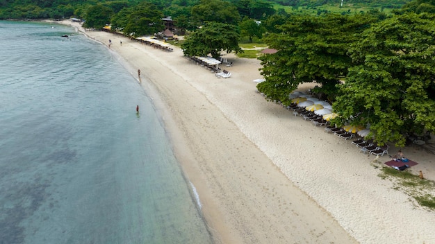 Natural Beach concept summer vacation Nature of tropical summer beach Umbrella board a boat and boat on the Sand Beach and Tourism Happy for playing on sand