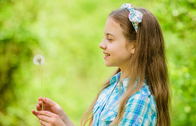 Natural beauty Childhood happiness summer vacation Rancho and country happy child hold blowball little girl and with taraxacum flower dandelion Spring holiday Womens day New green life