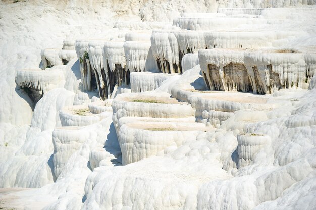 Natural carbonate formations on a mountain in Pamukkale, Turkey