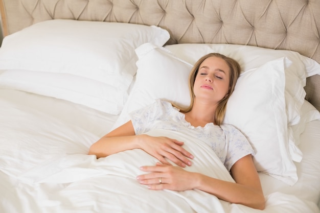 Natural content woman napping in bed