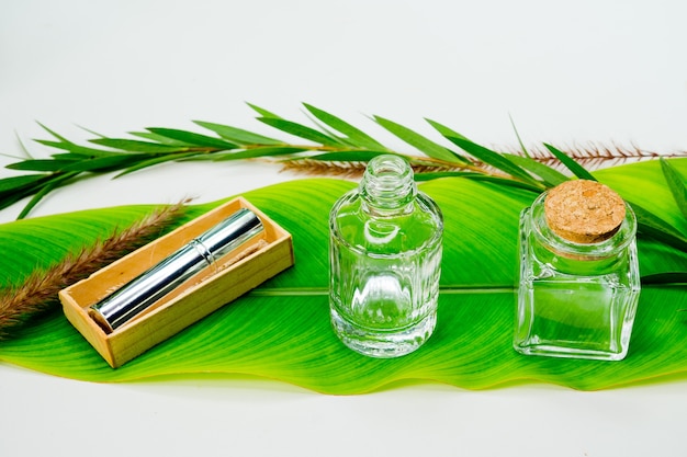 natural cosmetics bottle containers with green leaf