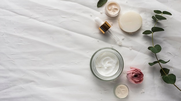 Natural cream and plant flat lay