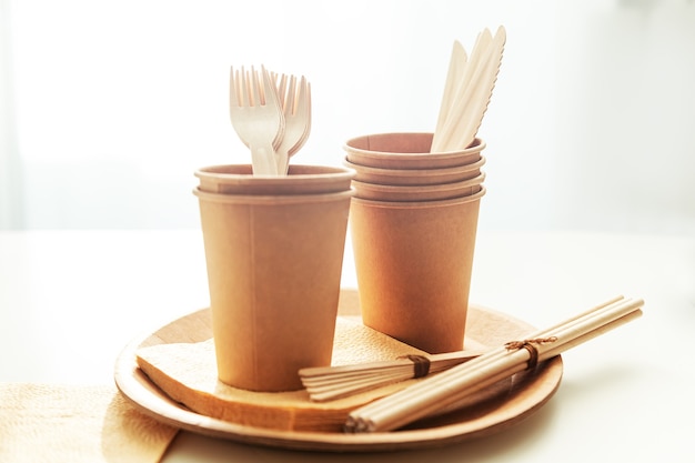 Natural environmentally friendly bamboo and paper tableware. The concept of recycling, nature conservation and saving the earth.