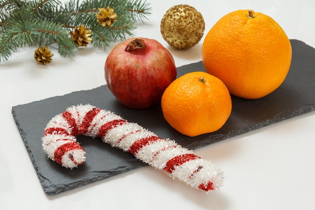 Natural fir tree branches and fruits on white background