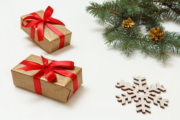 Natural fir tree branches with Christmas ornament on white background