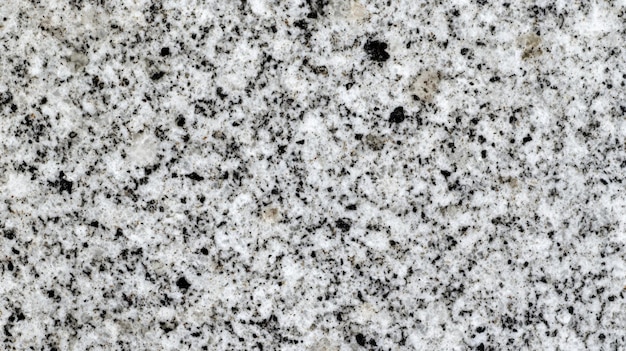 Photo natural granite texture showcasing a stunning blend of gray and black speckles in sunlight