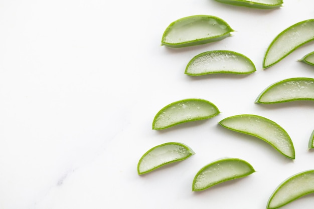 Natural green aloe vera stem cut into slices Health and well being background