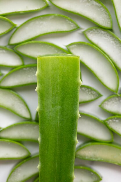 Natural green aloe vera stem cut into slices Health and well being background