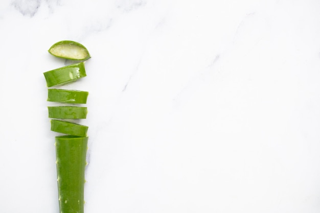 Natural green aloe vera stem cut into slices Health and well being background