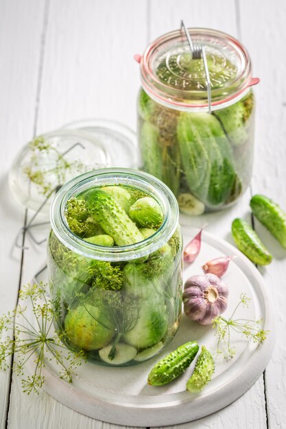 Natural and healthy pickled cucumber with garlic salt and dill