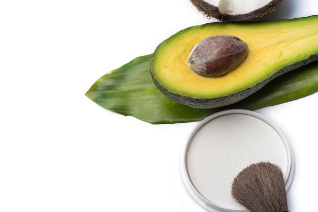 Natural herbal skin care products top ingredients coconut avocado isolated background makeup brushes