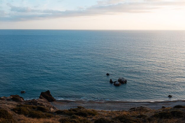 Natural landscape of beautiful sunset over Mediterranean sea in Cyprus near Aphrodite rock Winter time