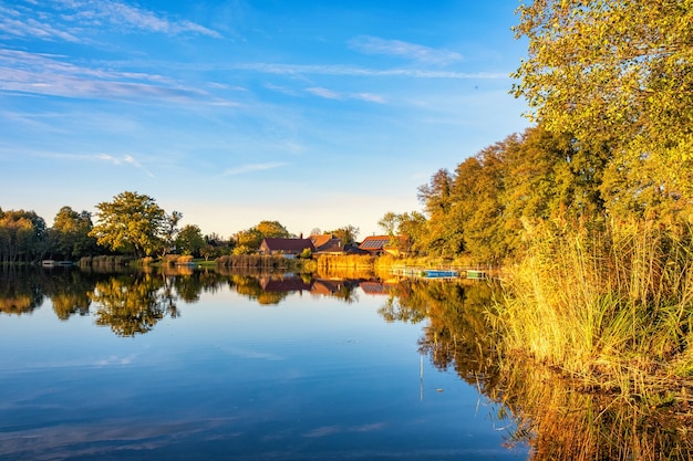 Natural landscape of the lake high definition the movement of waves against the background of the autumn forest The reflection of clouds on the ripples of water Germany