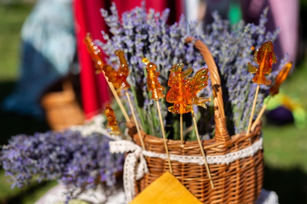 Natural lollipop cockerel at the fair on the background of lavender