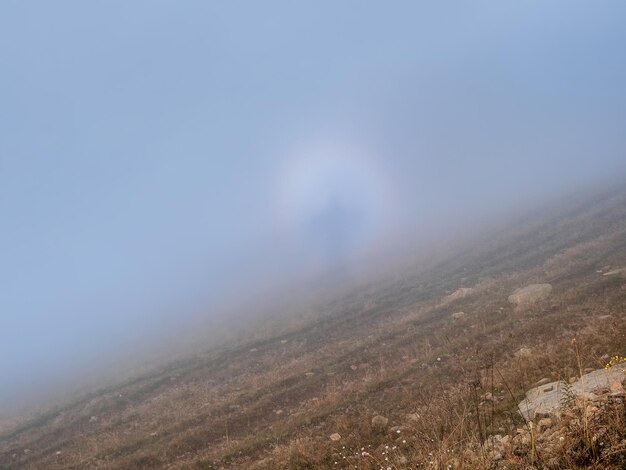 Natural phenomenon Brocken ghost also called the mountain ghost is the shadow of an observer on the surface of clouds in the direction opposite to the sun