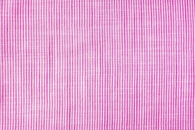 Natural pink linen texture with striped pattern as background wallpaper Top view flat lay