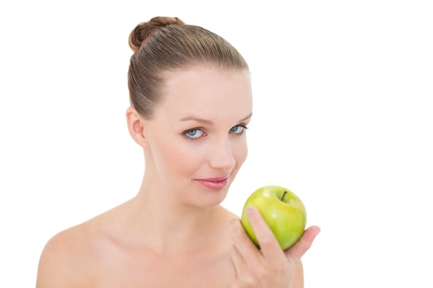 Natural pretty blonde model holding an apple