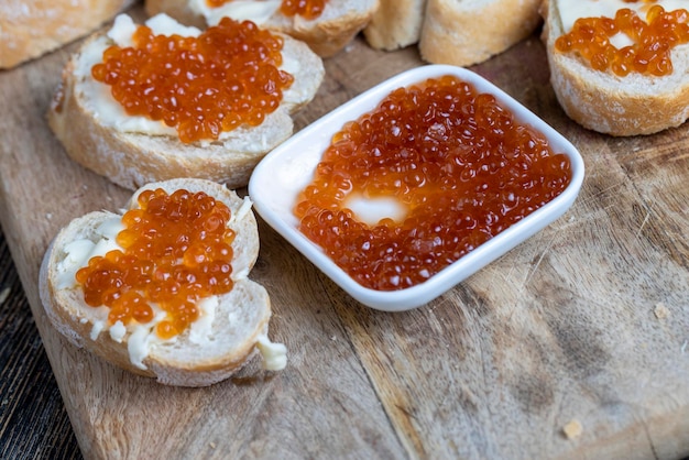 Natural red salmon caviar with baguette and butter