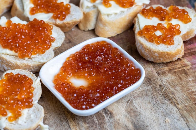 Natural red salmon caviar with baguette and butter