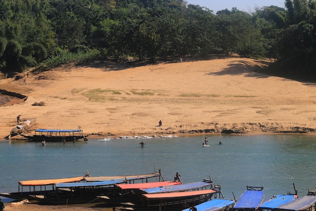 Natural scenery view.Local people or children are bathing in the river.