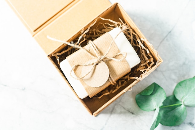 Natural soap in gift box with empty mockup tag