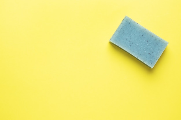 Natural soap on a yellow background. Flat lay the concept of Spa cleanliness of hands. copy space