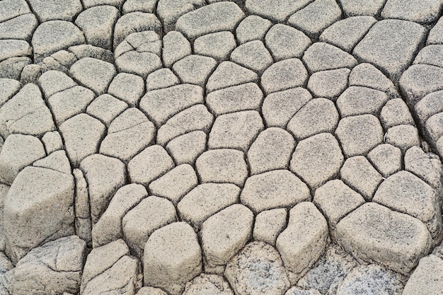 Natural stone background the remains of lava basalt columns form a kind of cobblestone causeway