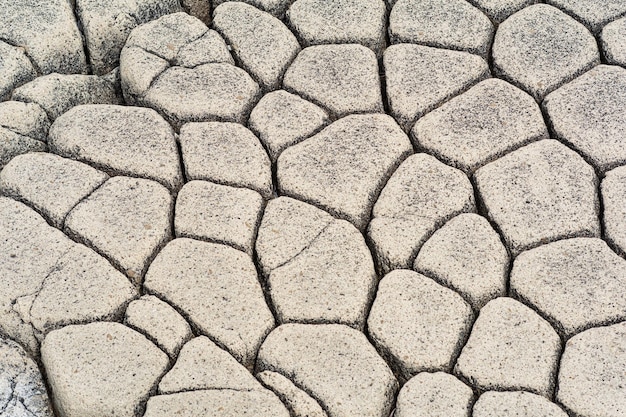 Natural stone background the remains of lava basalt columns form a kind of cobblestone causeway