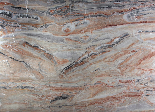 Natural stone marble pink with white, gray and red stains, called Arabescato Gold.