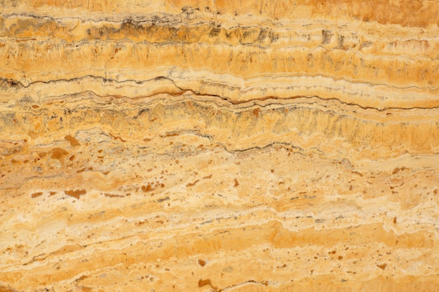 A natural stone, a polished yellow marble called Travertino Giallo.