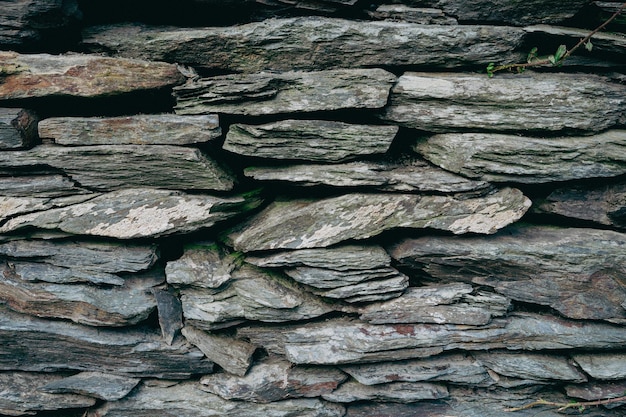 Natural stone wall texture. Slate stone background.