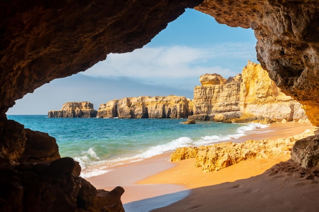 A natural summer beach cave at Praia da Coelha Algarve Albufeira Portugal