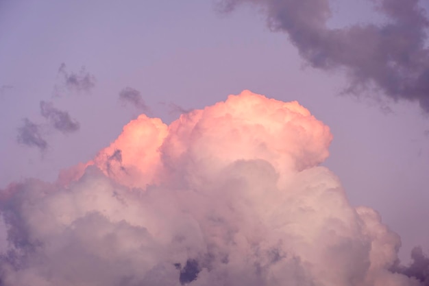 Natural sunny orange and blue sky background with beautiful puffy white cumulus clouds