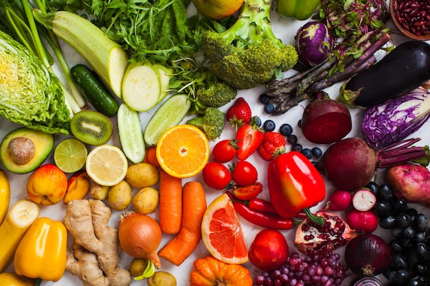 Natural vitamins and antioxidants food concept. Vegetables, fruits and berries rainbow top view.