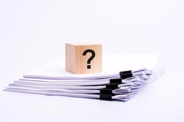 Natural wooden block with question mark white background