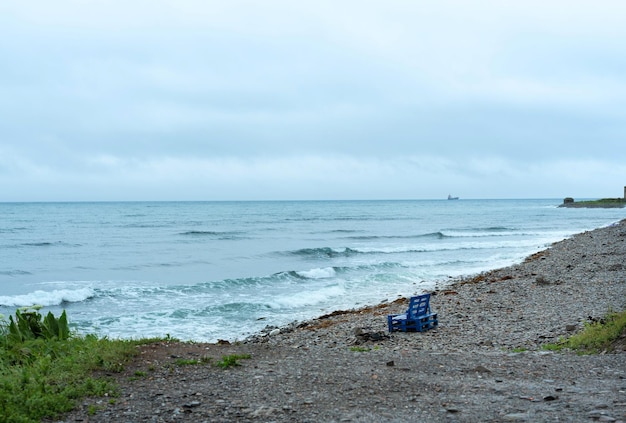 Nature background with sea waves hitting the sea shore Scenic view of sea against cloudy sky