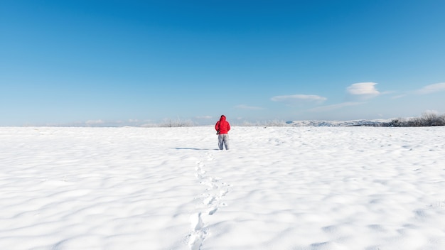 Nature photographer on a snowy field