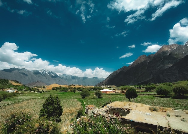 Nature View of Greenery Field with fresh water lake and mountains