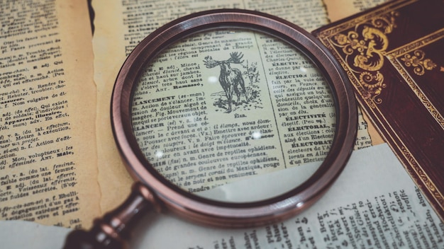 Nautical Magnifying Glass On Old Book