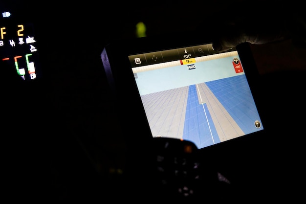 Navigation monitor on a special tractor for treating fields from weeds.